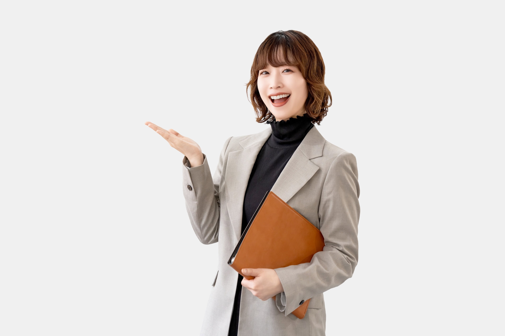 手で案内をする女性・ビジネスウーマン